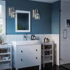 Nicholas Clear 1-Light Brushed Nickel Wall Sconce by Quoizel -Quoizel Sales brushed nickel quoizel vanity lighting nlc8601bn 31 1000