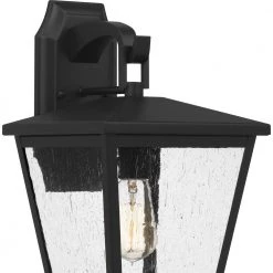 Joffrey 9 in. 1-Light Matte Black Outdoor Wall Lantern Sconce with Clear Seeded Glass by Quoizel -Quoizel Sales matte black quoizel outdoor sconces jfy8409mbk 44 1000