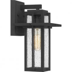 Randall 7 in. 1-Light Mottled Black Outdoor Wall Lantern Sconce with Clear Seeded Glass by Quoizel